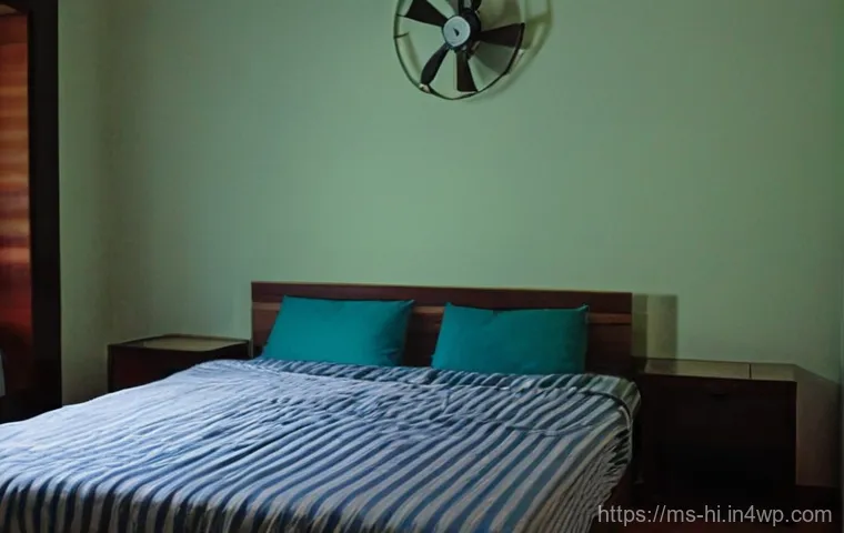 체온 조절로 수면 질 개선하기 - A young adult, looking slightly uncomfortable and restless, is in a modest bedroom at night, attempt...